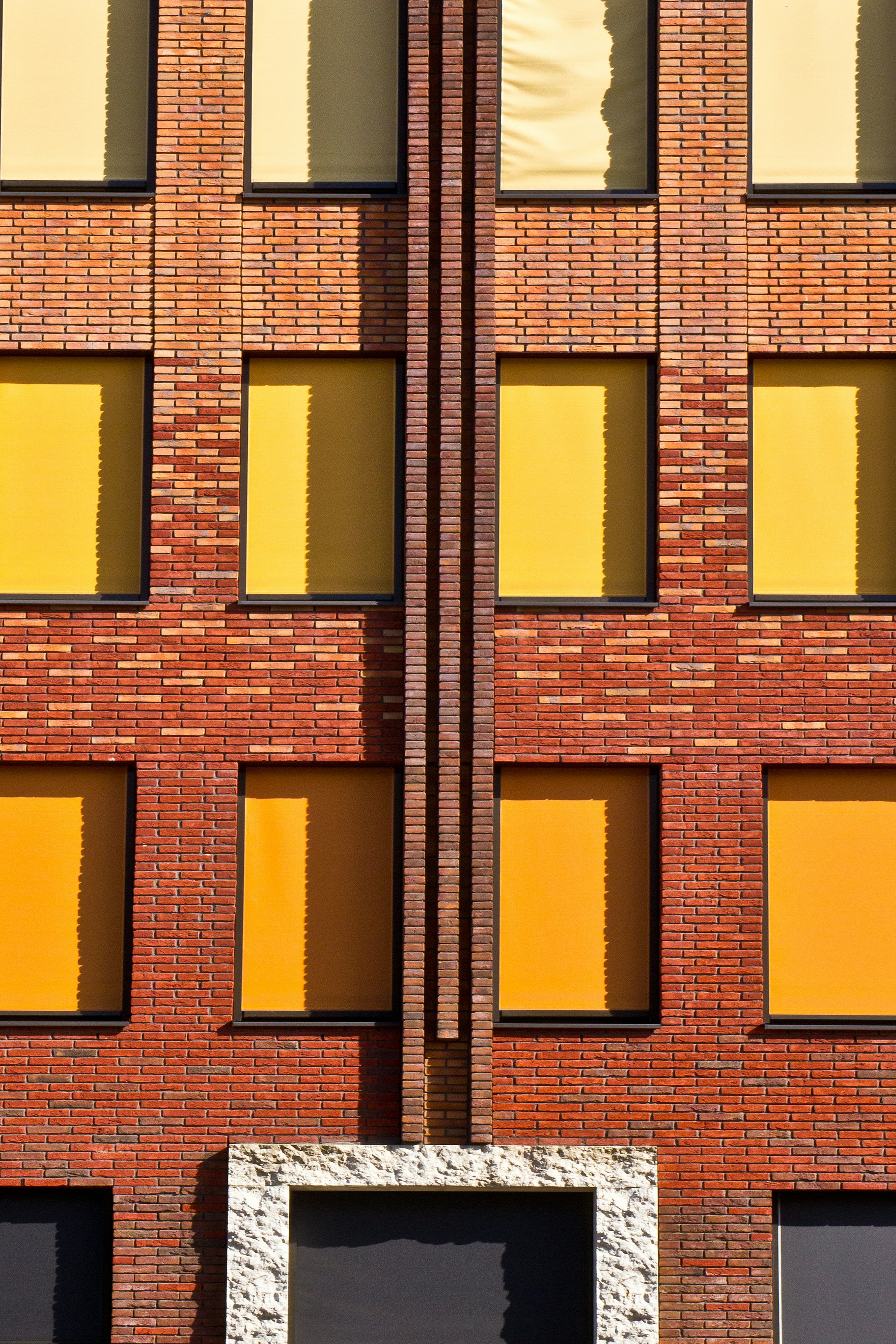 Brick Building with Yellow and Orange Blinds